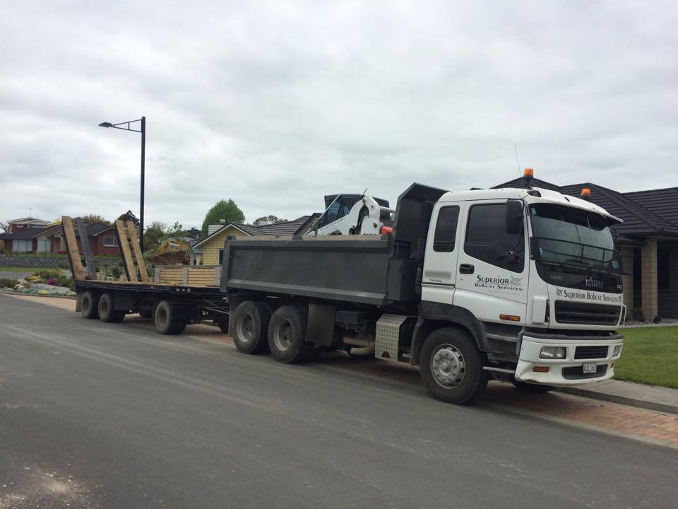 Superior Bobcat truck and bobcat on the way to a job